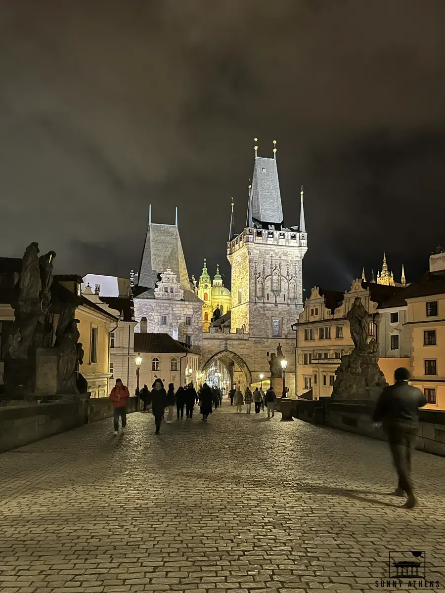 4 Days in Prague: People walking on Charles Bridge at night.