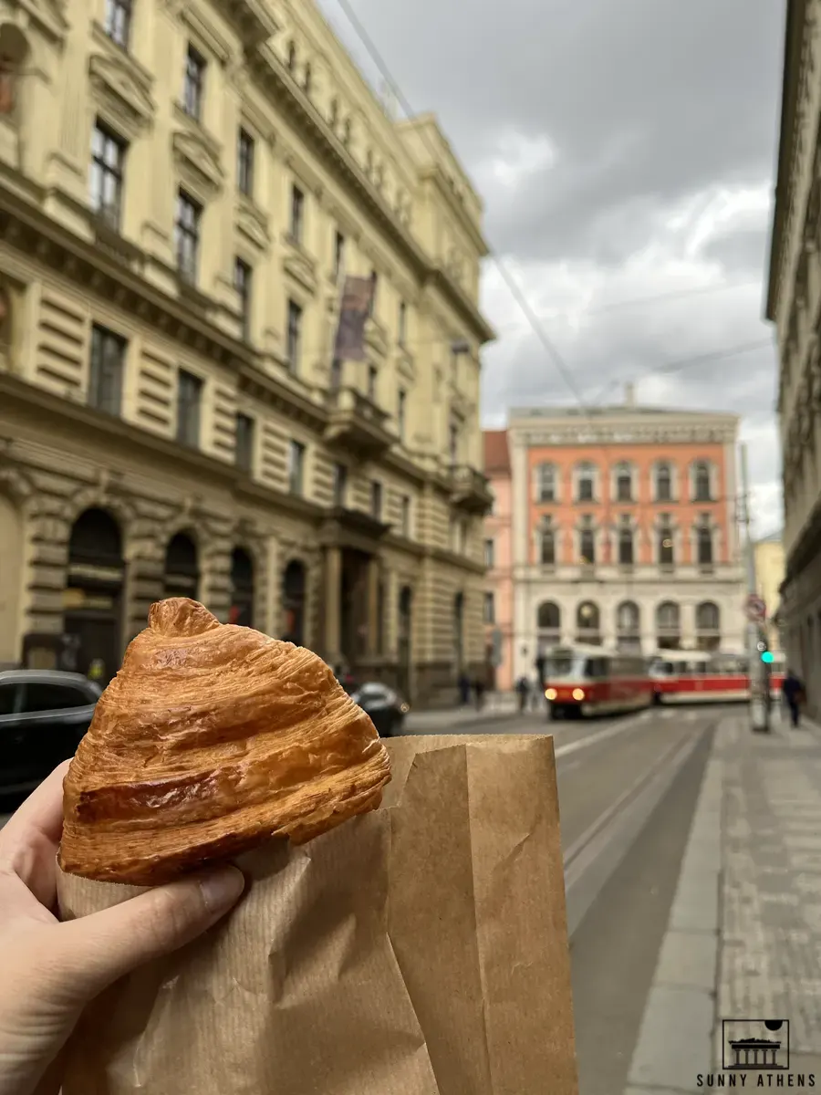 4 Days in Prague: Holding a croissant in Prague