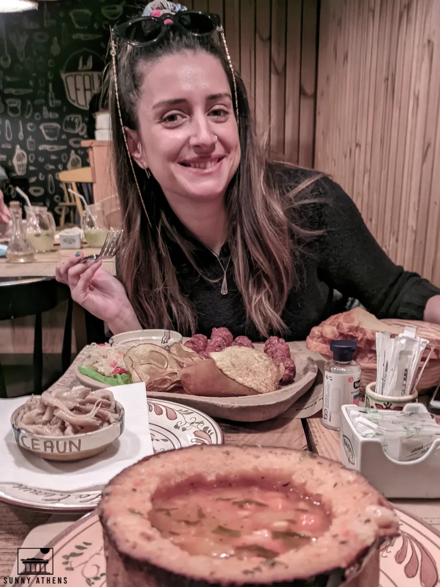 Traditional Romanian Food: Bean soup in bread and mititei.