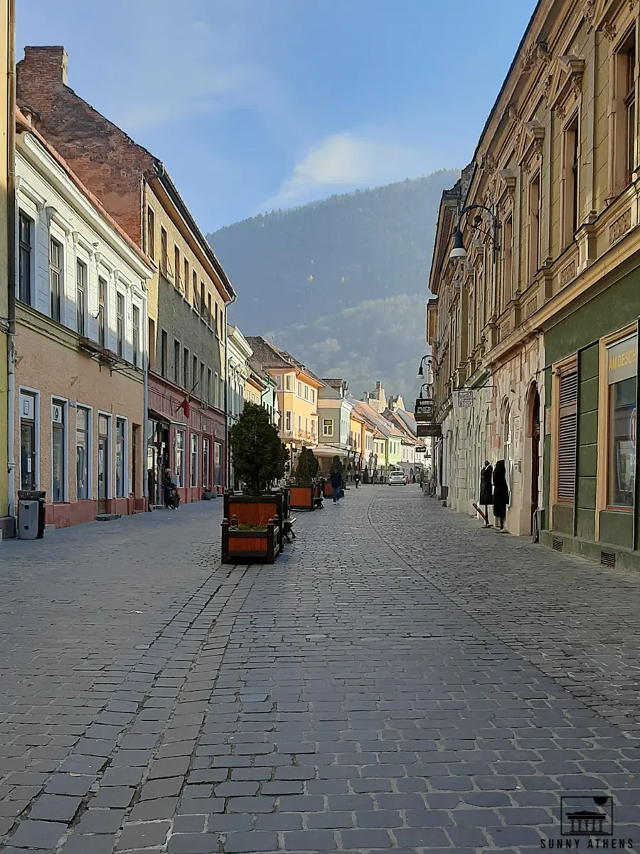 The Strada Republicii with a green hill in the background.