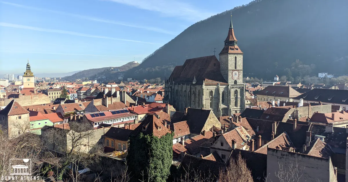 Unique Experiences in Brasov: panoramic view of the Black Church, surrounded by old houses.