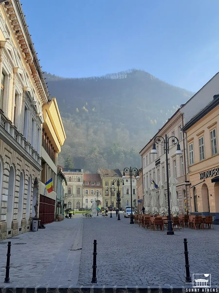 Brasov in 2 Days Itinerary: The Strada Apollonia Hirscher and the Brasov sign in the background.