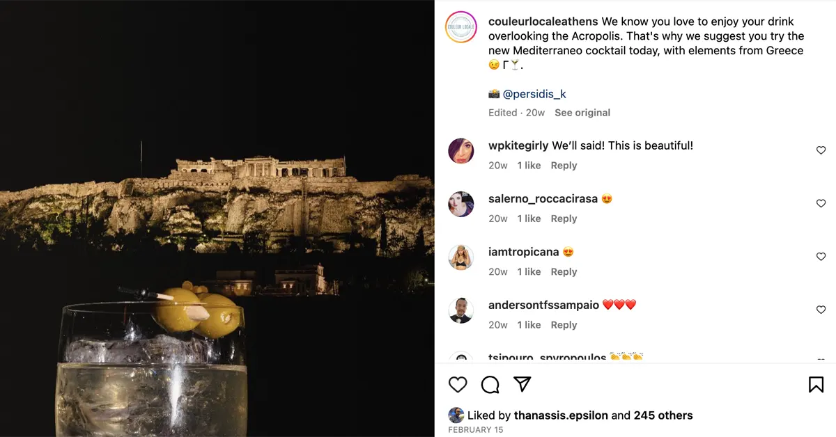 Best Rooftop Bars in Athens: A close-up of a cocktail at Couleur Locale, with the Acropolis majestically standing in the background.