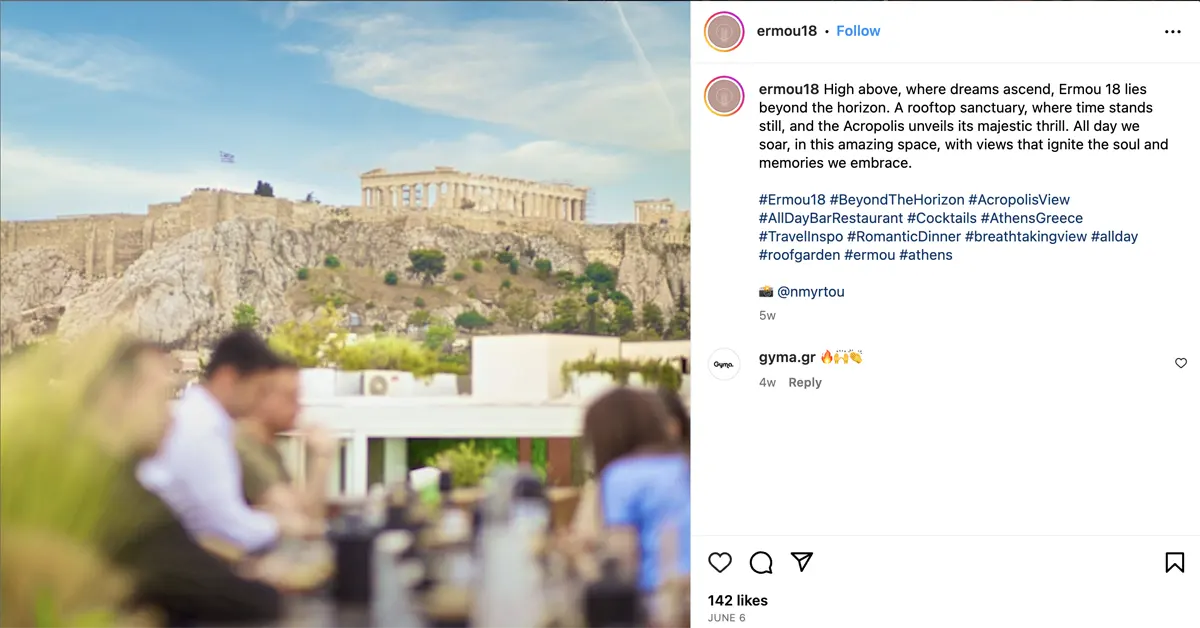 Best Rooftop Bars in Athens: People chatting at Ermou 18 during the day with the Acropolis in the background.