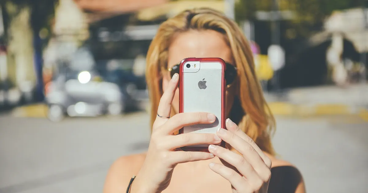 Woman holding an iPhone