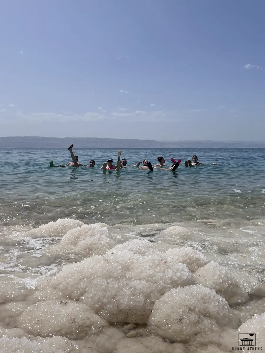 7 Days in Jordan Itinerary: Our group of 8 friends floating in the Dead Sea.