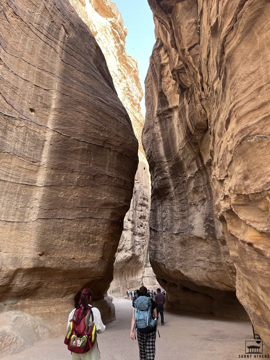 People traversing the Al-Siq trail, the main entrance to the ancient city of Petra.