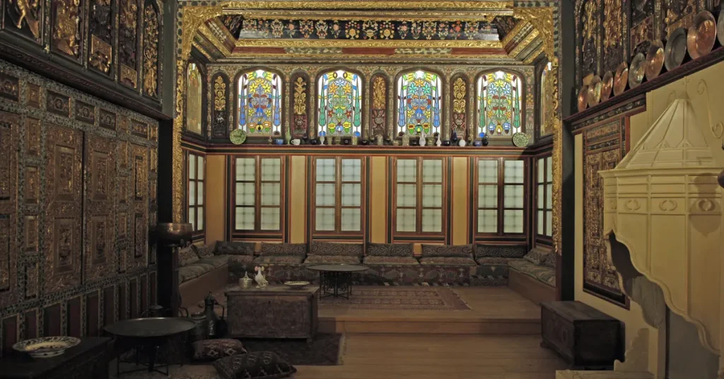 Benaki Museum: A room with colorful glass windows and walls covered in detailed designs.