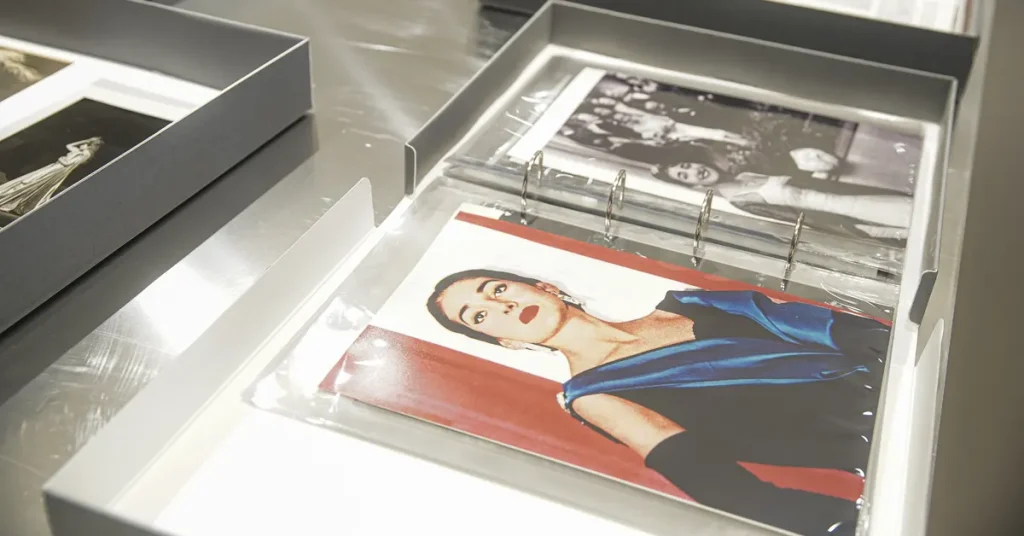 A display case containing a collection of photographs of Maria Callas.