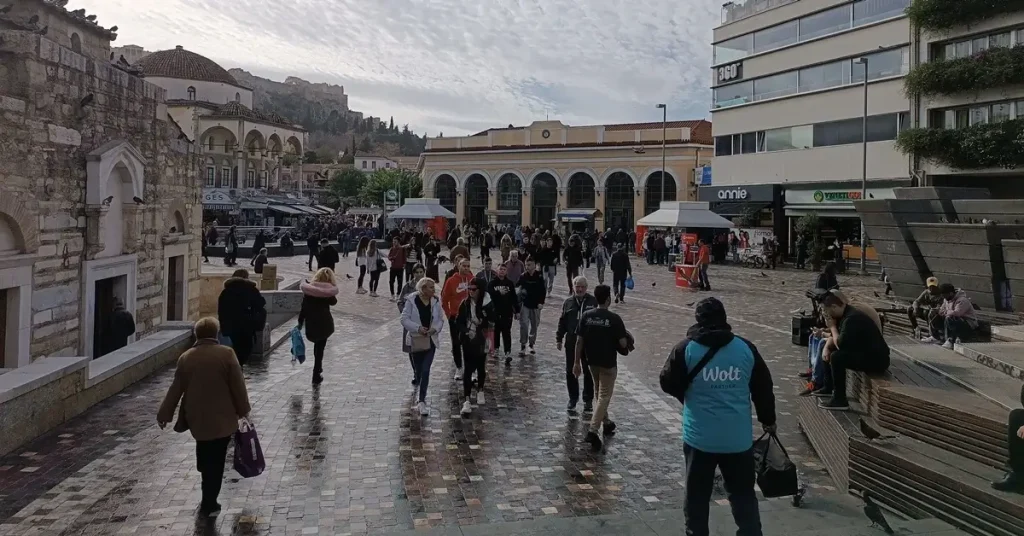 People walking at the famous Monastiraki square in Athens.