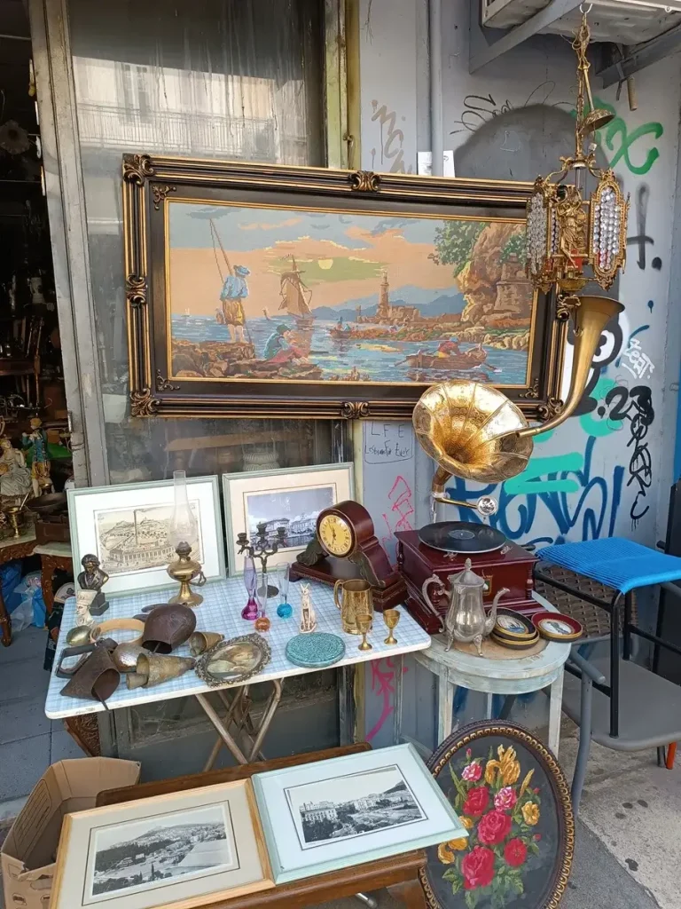 An old painting, a grammophone and some other antiques at a store in Monastiraki flea market, one of the most famous local markets in Athens.