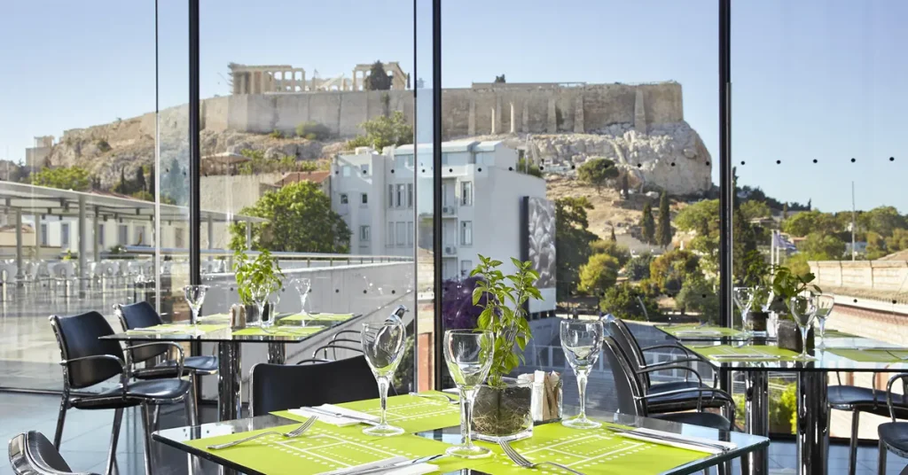 Panoramic view of the Acropolis hill as seen from the café inside the Acropolis Museum.