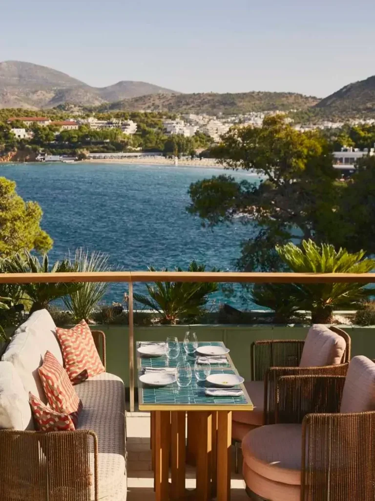 A dining table in Astir Palace hotel restaurant with view to the sea