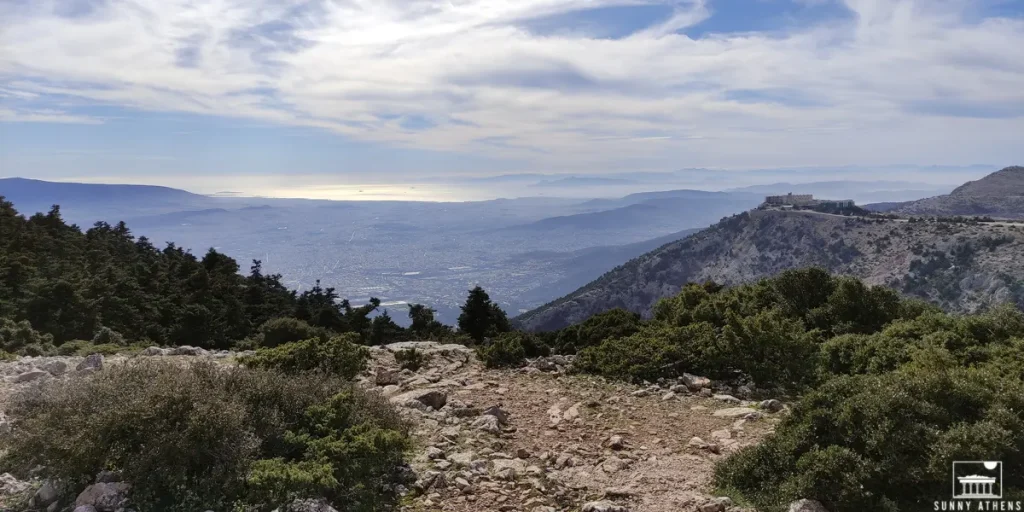 Winter in Athens: a panoramic view from Mount Parnitha, overlooking the Athens, with surrounding mountains and the sea in the background.