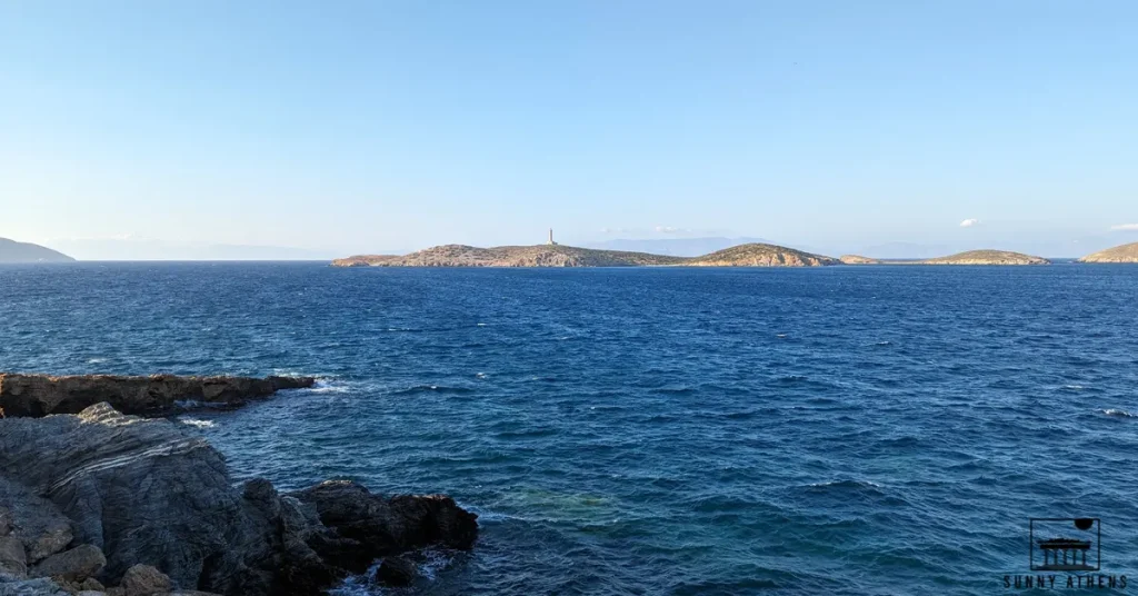 Panoramic view of the Aegean Sea with islands and a lighthouse in the background.