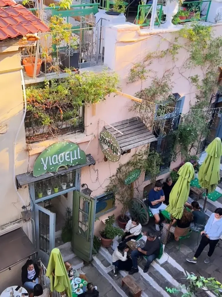 The beautiful cafe bistrot Yasemi in Plaka, Athens, with people enjoying coffee and having a great time.