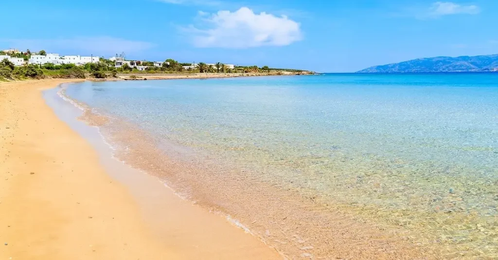 A beautiful sandy beach in Paros, with crystal-clear waters, during a summer day.