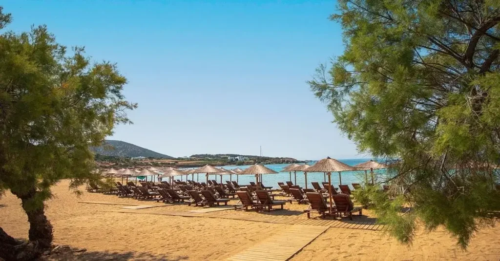 Sunbeds at the beautiful beach of Faragas in Paros Greece.