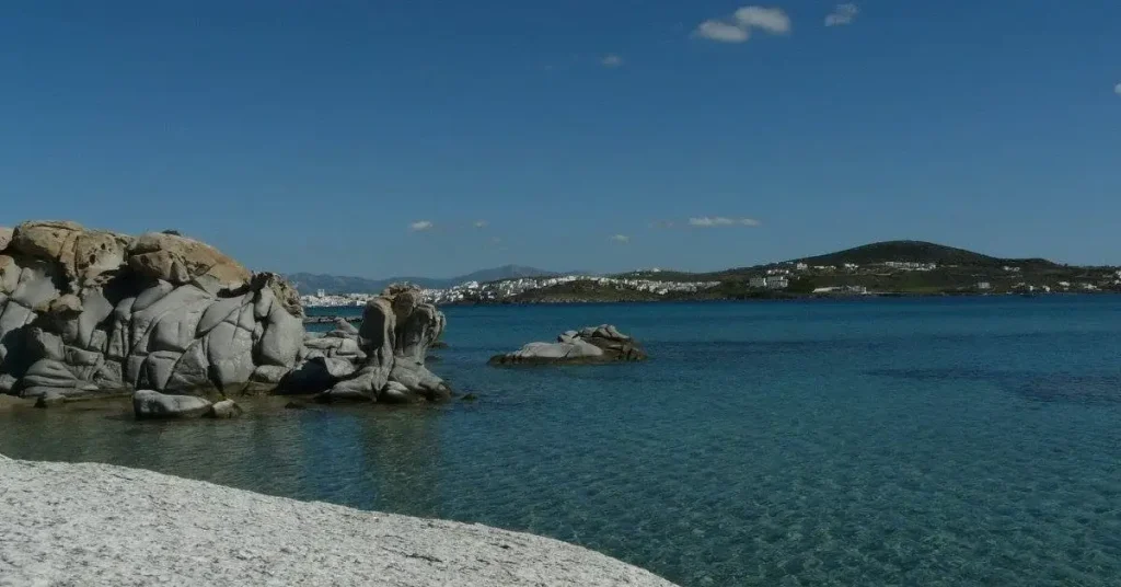 Impressive rock formations emerging from the sea at the famous Kolympethres beach, one of the best beaches in Paros Greece.