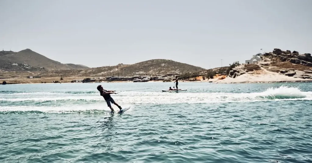 People doing water ski and SUP at Monastiri beach in Paros Greece.