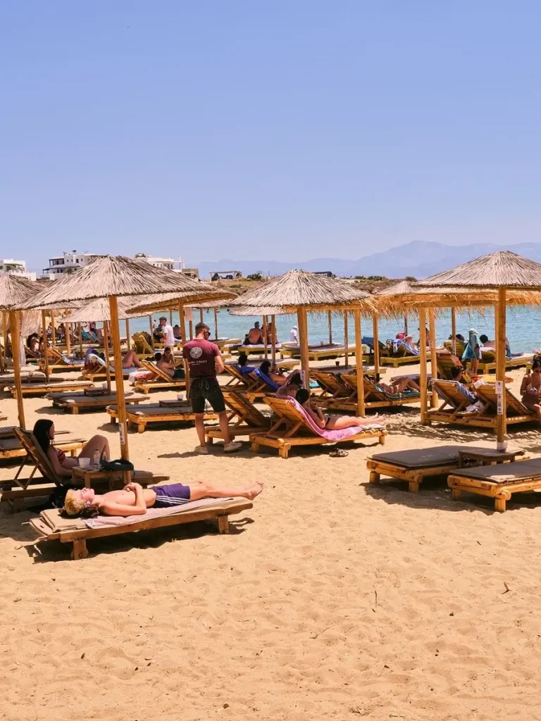 Umbrellas and sunbeds at Punda Beach, one of the best beaches in Paros Greece.