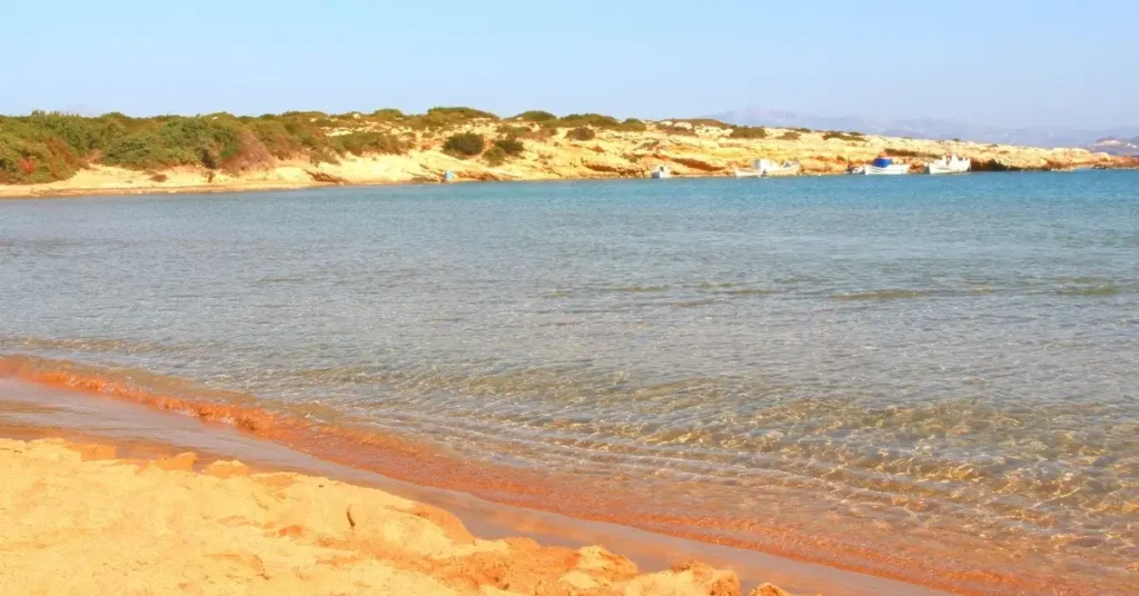 The crystal clear waters of Mikri Santa Maria Beach in Paros Greece.