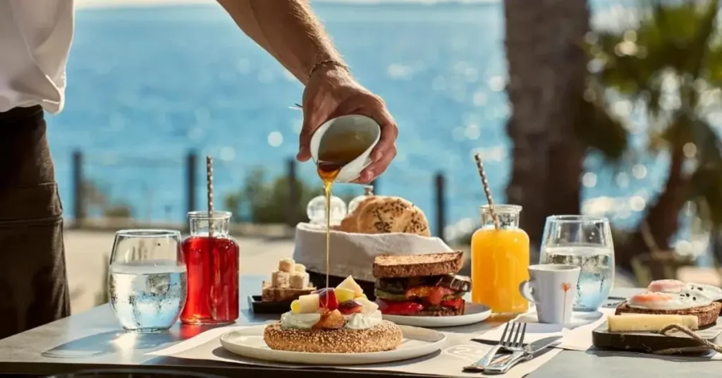 Rich breakfast featuring traditional Greek dishes served in the restaurant of Poseidon of Paros Hotel & Spa.