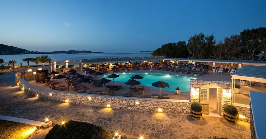 The impressive pool bar of Saint Andrea Resort hotel in Paros Greece at dusk.