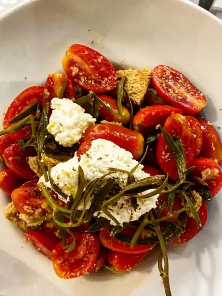 A village salad dish with cherry tomatoes, sea fennel, and feta cheese.