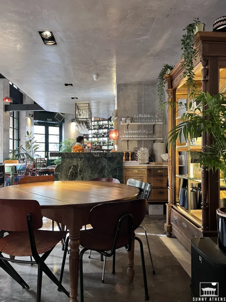 A stylish table and the elegant marble bar at Neratzia Café Bistrot.