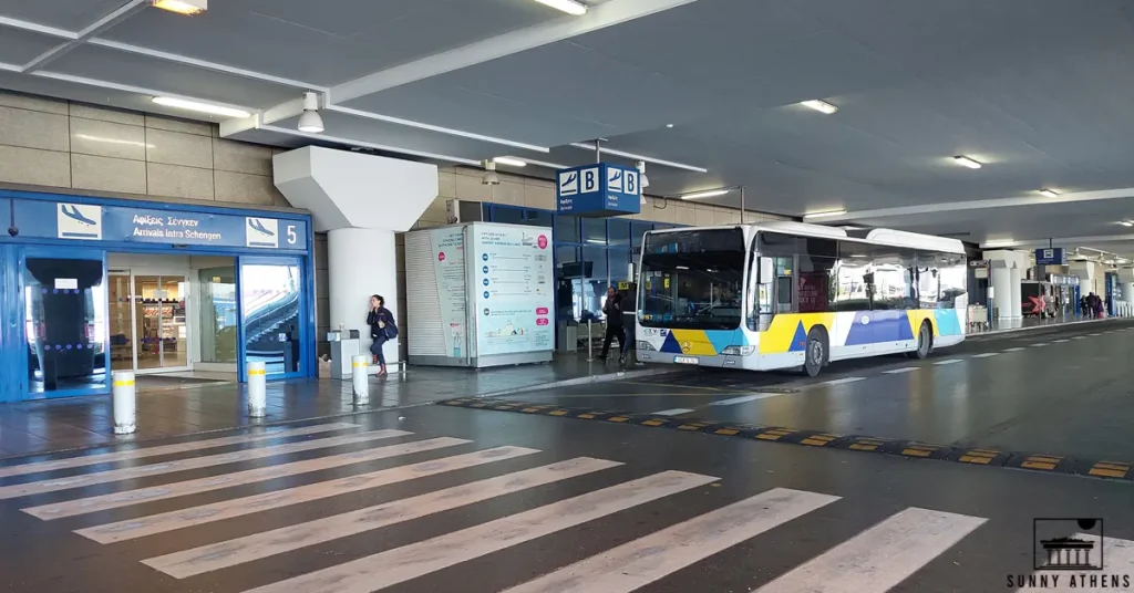 A bus is waiting outside Gate 5 at Athens International Airport.