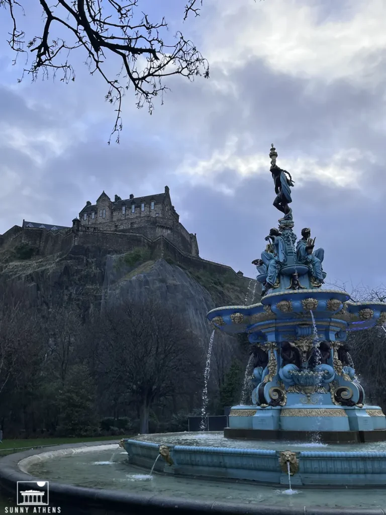 4 days in Edinburgh itinerary: The blue and gold Ross Fountain in the Princes Street Gardens with Edinburgh Castle in the background.