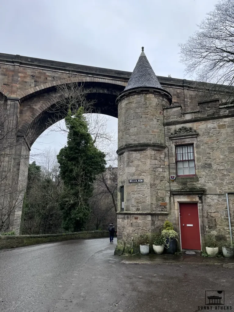 4 days in Edinburgh itinerary: a small, round stone tower with a big arch bridge overhead.