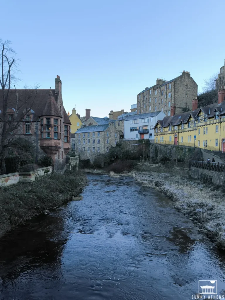 4 days in Edinburgh itinerary: The serene Water of Leith river flowing through traditional stone buildings on both sides.