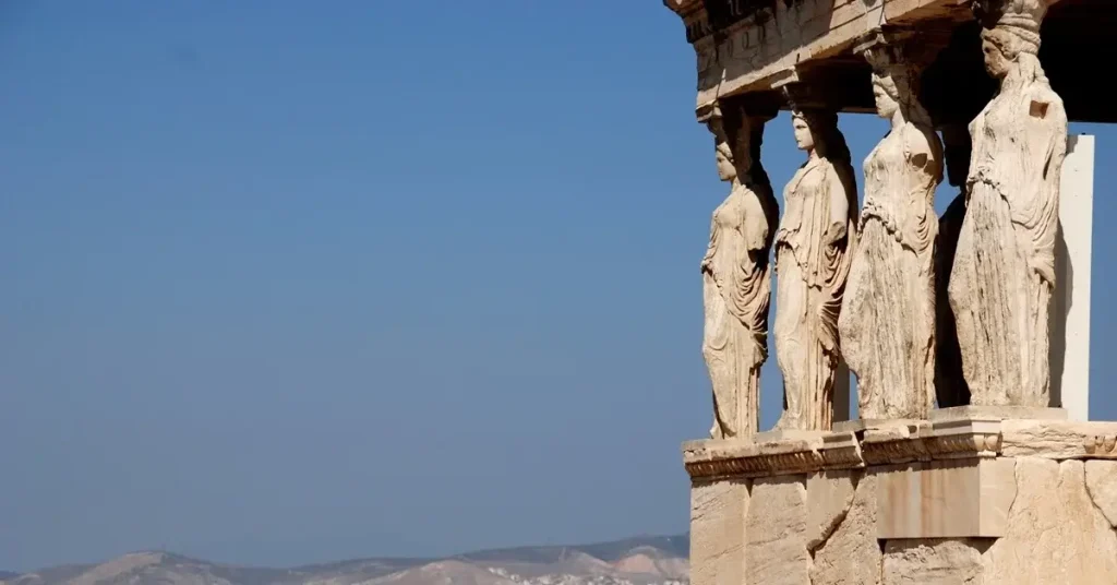 Marvelous statues of the Kores at the Acropolis in Athens, set against the backdrop of the clear blue Attic sky.