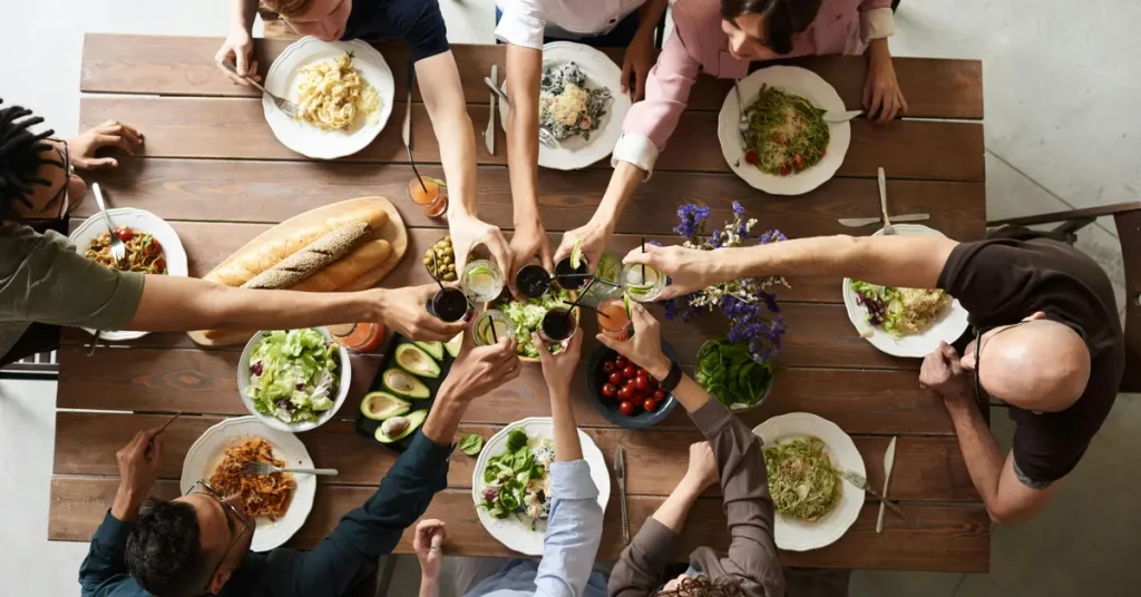 A group of friends enjoying dinner during one of the food tours in Athens for foodies.