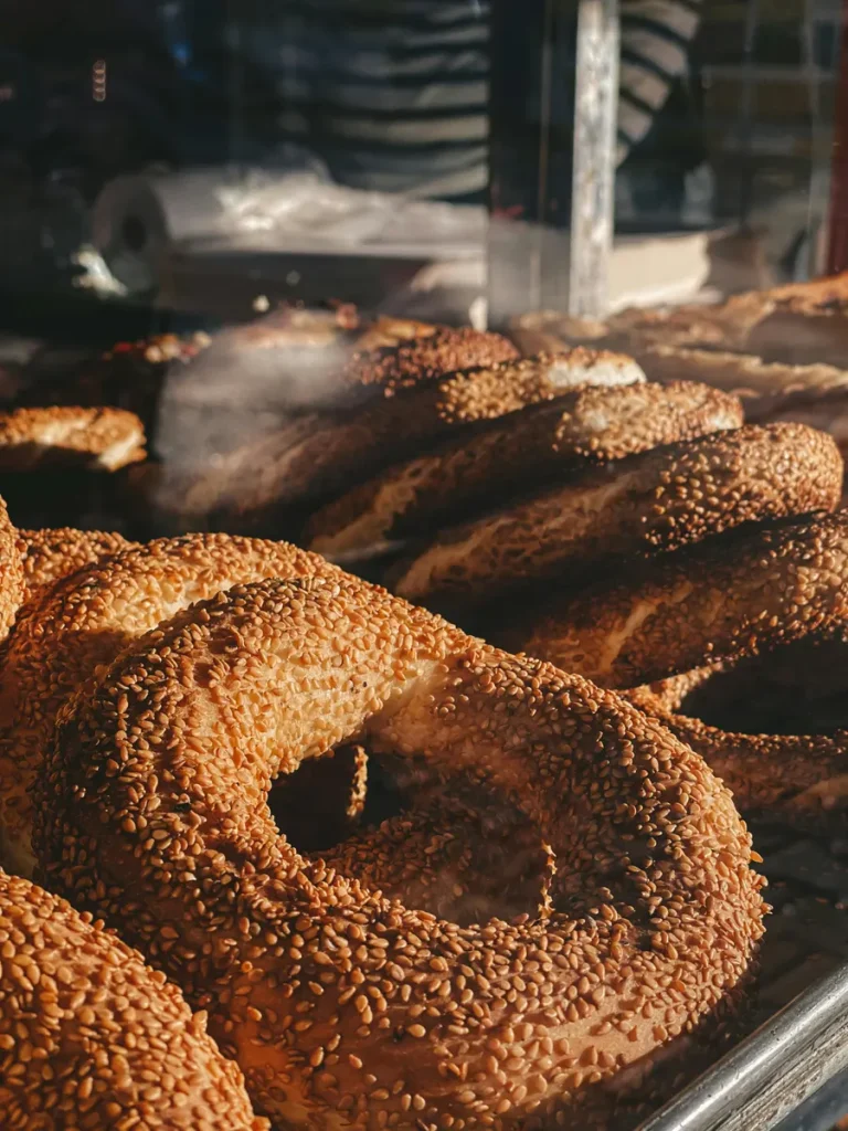 Freshly baked sesame bread rings from a local bakery, a staple on street food tours in Athens.