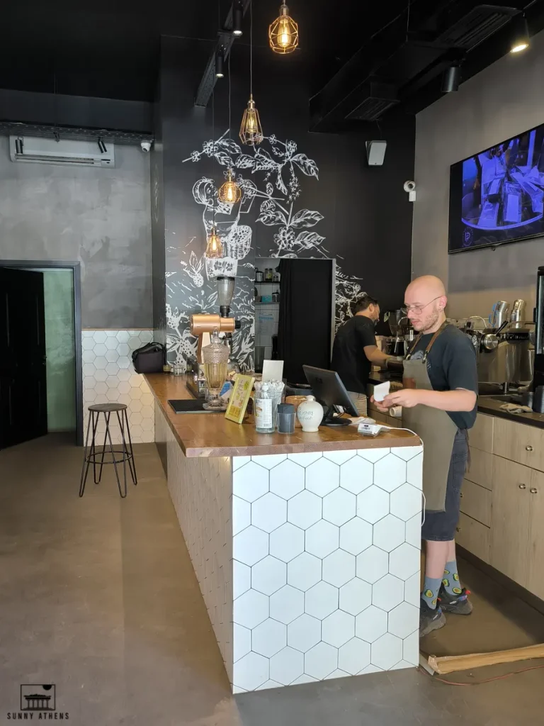 The interior of Handpickers Coffee Shop, a local favorite in Tavros area.